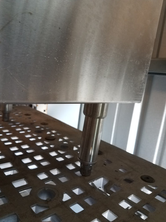 Stainless steel enclosed base table with marble top