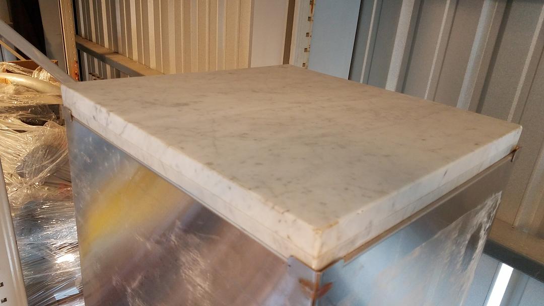 Stainless steel enclosed base table with marble top